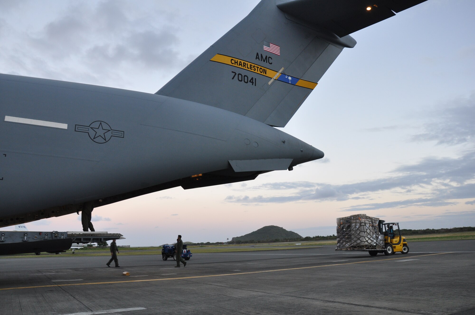 Reservists from the 315th Airlift Wing at Charleston Air Force Base deliver humanitarian aid to the Island nation of St. Lucia.  The C-17 Globemaster III delivered more than 11,000 pounds of supplies during the mission. (U.S. Air Force Photo\Capt. Wayne Capps)