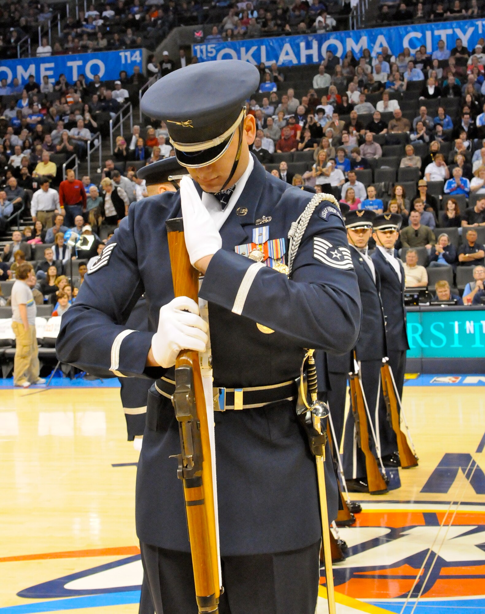 Tech. Sgt. Michael Doss, member of The U.S. Air Force Honor Guard drill team, performs the halftime show Feb. 15 on the Oklahoma City Thunder quart for military appreciation night. The performance is Sergeant Doss’ final performance with drill team. (U.S. Air Force photo by Airman 1st Class Tabitha N. Haynes)