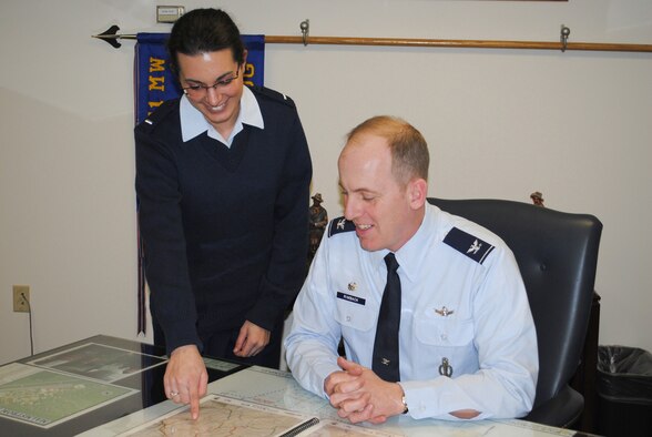 1st Lt. Shannon Howe, 341st Operations Group executive officer,  points out to Col. Edward Rimback, the new 341st OG commander, one of the facilities in the missile complex.  As the new OG commander, Colonel Rimback intends to maintain the high level of excellence the group is known for. (U.S. Air Force photo/Airman Cortney Hansen)
