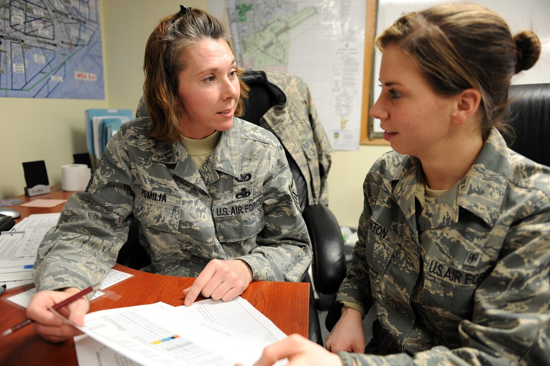 KUNSAN AIR BASE, Republic of Korea -- Master Sgt. Kristie Pomilia, 134th Expeditionary Fighter Squadron member, reviews a flying schedule with Senior Airman Crystalin Horton, also of the 134th EFS here Feb. 22. Ensuring all pilots are up-to-date on their flying hours is essential to the unit's mission here. (U.S. Air Force photo/Tech. Sgt. Jonathan Pomeroy)