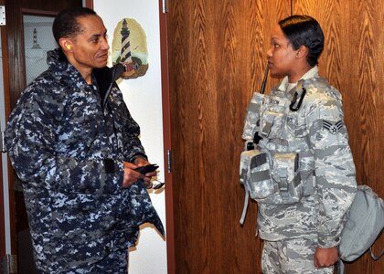 Vice Admiral Cecil Haney, U.S. Strategic Command deputy commander, is greeted by Senior Airman Randi Gibson, 90th Missile\r\nSecurity Forces Squadron, upon his helicopter arrival at Juliet-01 during his visit to the missile field Feb. 22.