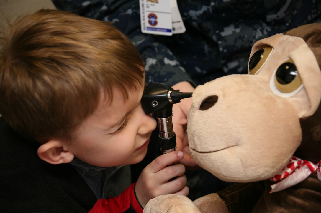 Liam Fortin examines a stuffed animal’s nose during a kindergartner’s visit to Naval Health Clinic Cherry Point Feb. 23. More than 100 children from Arthur W. Edwards Elementary School came to the clinic to learn about nine different sections including Radiology and Pediatrics. “I feel that it helps the kids learn about what it takes to stay healthy so they do not have to visit us much,” said Laurie Varner, the public affairs officer for the clinic. “Plus it helps them to not fear the doctors.”