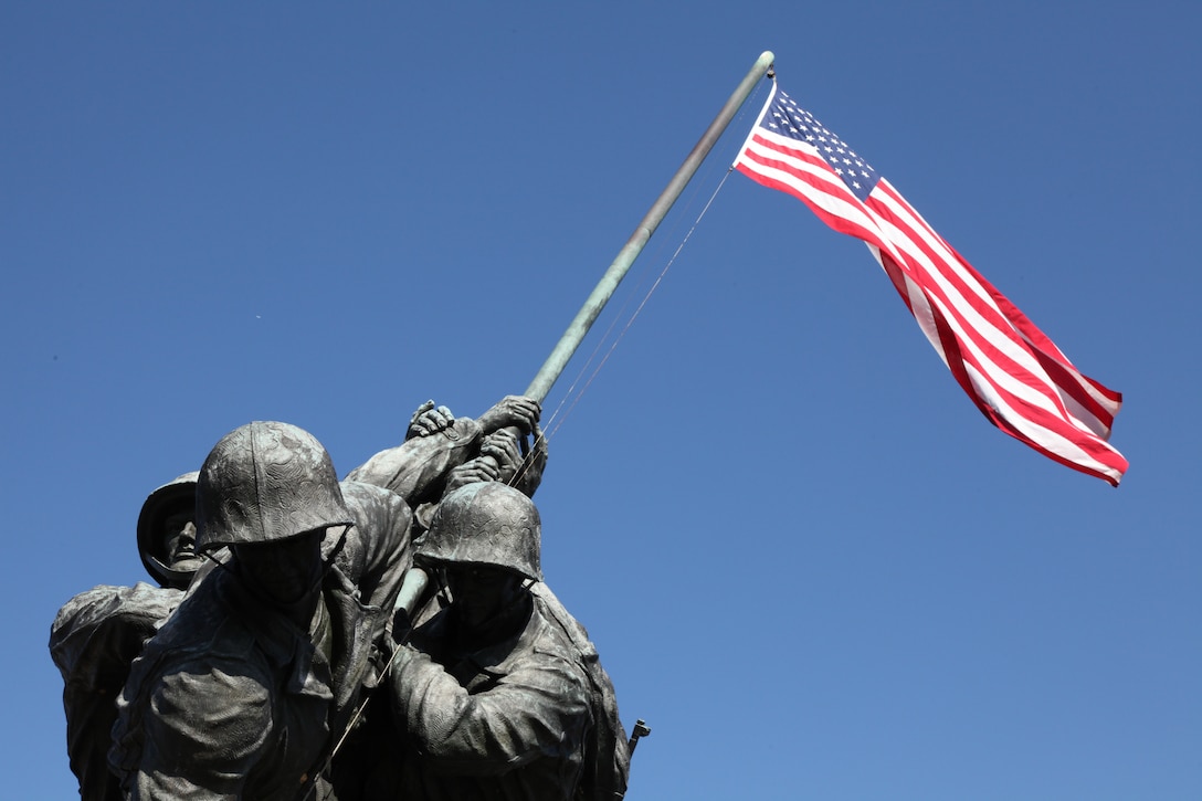 The Marine Corps War Memorial is a sculpture depicting the five Marines and one Navy corpsman who raised the second American flag atop Mount Suribachi during the Battle of Iwo Jima. The statue by Felix de Weldon is based off of Joe Rosenthal’s famous photo.