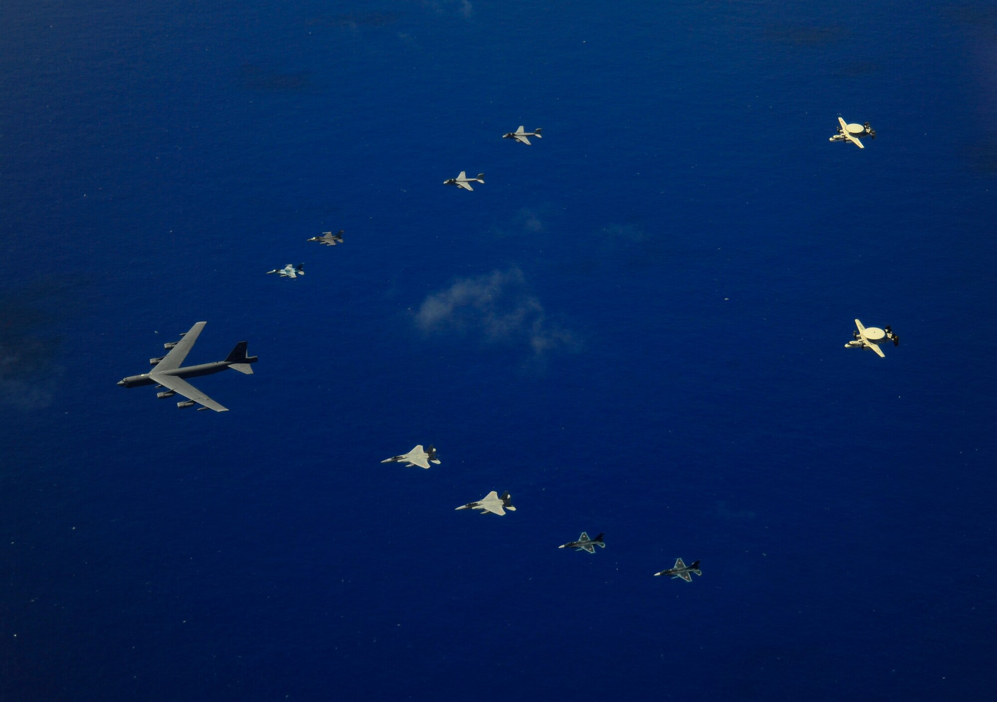 A U.S. Air Force B-52 Stratofortress aircraft from the 20th Expeditionary Bomb Squadron leads a formations of two F-16 Fighting Falcon aircraft assigned to the 18th Aggressor Squadron, an F-16CJ Fighting Falcon from Misawa, Japan, an F-15J Eagle from Chitose Japan, two Japanese Air Self-Defense Force F-2 attack fighters from the 6th Tactical Fighter Squadron, two U.S. Navy EA-6B Prowler aircraft from the Electronic Attack Squadron, an U.S. Navy E-2C Hawkeye and a Japanese E-2C Hawkeye aircraft on a flight over Guam during exercise Cope North Feb. 21, 2011.  The U.S. Air Force and Japanese Air Self-Defense Force conduct Cope North annually at Andersen Air Force Base, Guam to increase combat readiness and interoperability concentrating on coordination and evaluation of air tactics, techniques and procedures. (U.S. Air Force photo by Staff Sgt. Angelita M. Lawrence/Released)