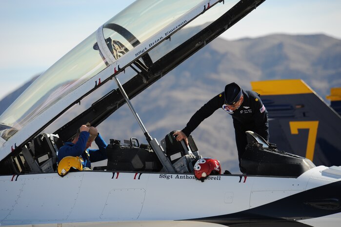 Maj. Aaron Jelinek (right), U.S. Air Force Air Demonstration Squadron "Thunderbirds" lead solo and Lt. Ben Walborn, U.S. Navy Blue Angels lead solo, return from a training mission at Nellis Air Force Base, Nev., Feb. 23, 2011.(U.S. Air Force Photo/Staff Sgt. Larry E. Reid Jr.)