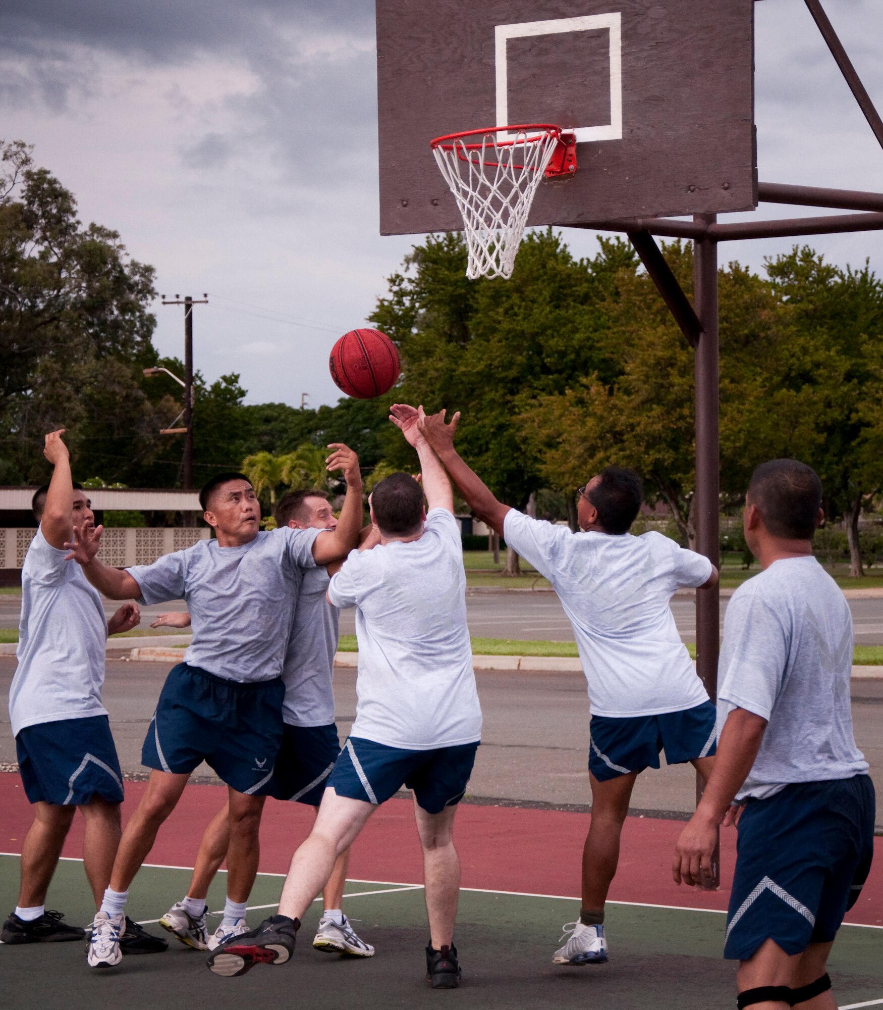 Members of the 48th Aerial Port Squadron, Joint Base Pearl Harbor-Hickam, Hawaii, play a game of basketball, Feb. 13, as part of their wingman day activities. The theme for Wingman Day 2011 was resiliency and unit members received briefings and participated in various team building exercises. This annual event allows Airmen to step back from their day-to-day Reserve duties and focus on taking care of each other as wingmen. (U.S. Air Force Photo/Staff Sgt. Erin Smith) 