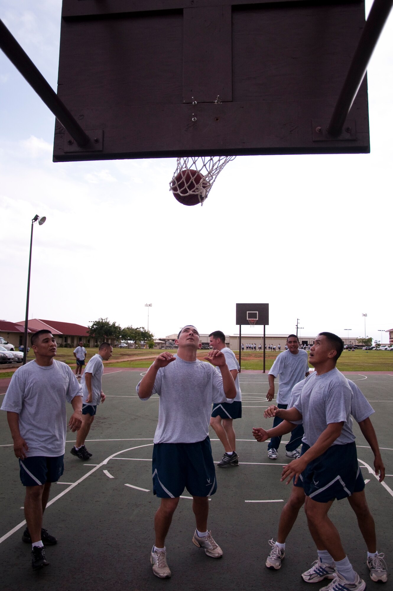 Members of the 48th Aerial Port Squadron, Joint Base Pearl Harbor-Hickam, Hawaii, play a game of basketball, Feb. 13, as part of their wingman day activities. The theme for Wingman Day 2011 was resiliency and unit members received briefings and participated in various team building exercises. This annual event allows Airmen to step back from their day-to-day Reserve duties and focus on taking care of each other as wingmen. (U.S. Air Force Photo/Staff Sgt. Erin Smith) 