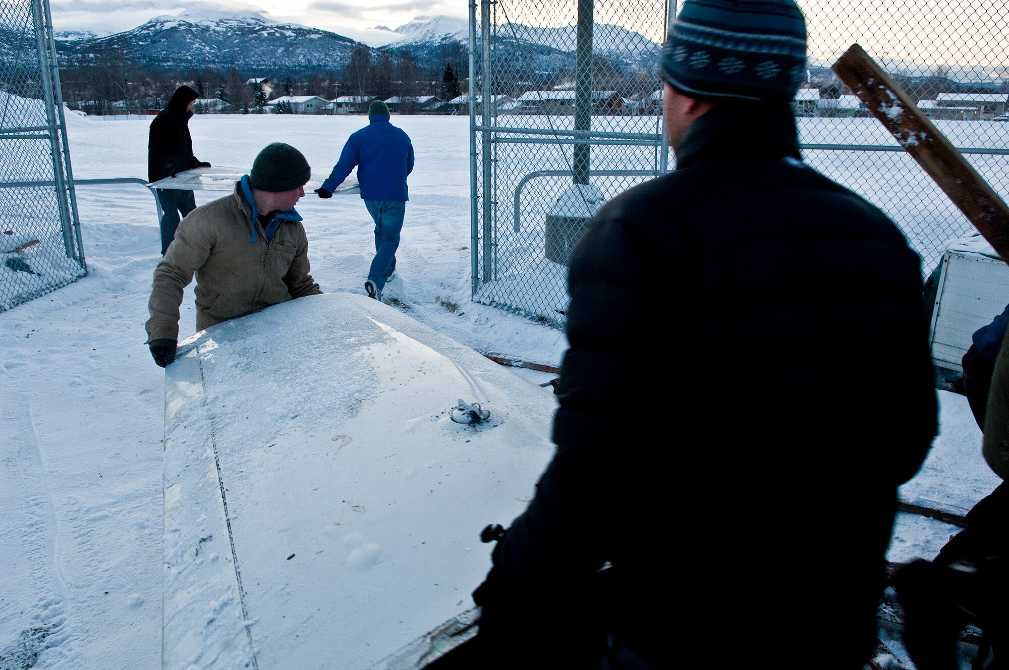 ANCHORAGE, Alaska -- Volunters from Joint Base Elmendorf-Richardson move an ultra-light model plane to Begich Middle School for the Build-a-Plane program. The Build-a-Plane program is designed to inspire children to become involved in aviation. (U.S. photo/Airman 1st Class Jack Sanders)