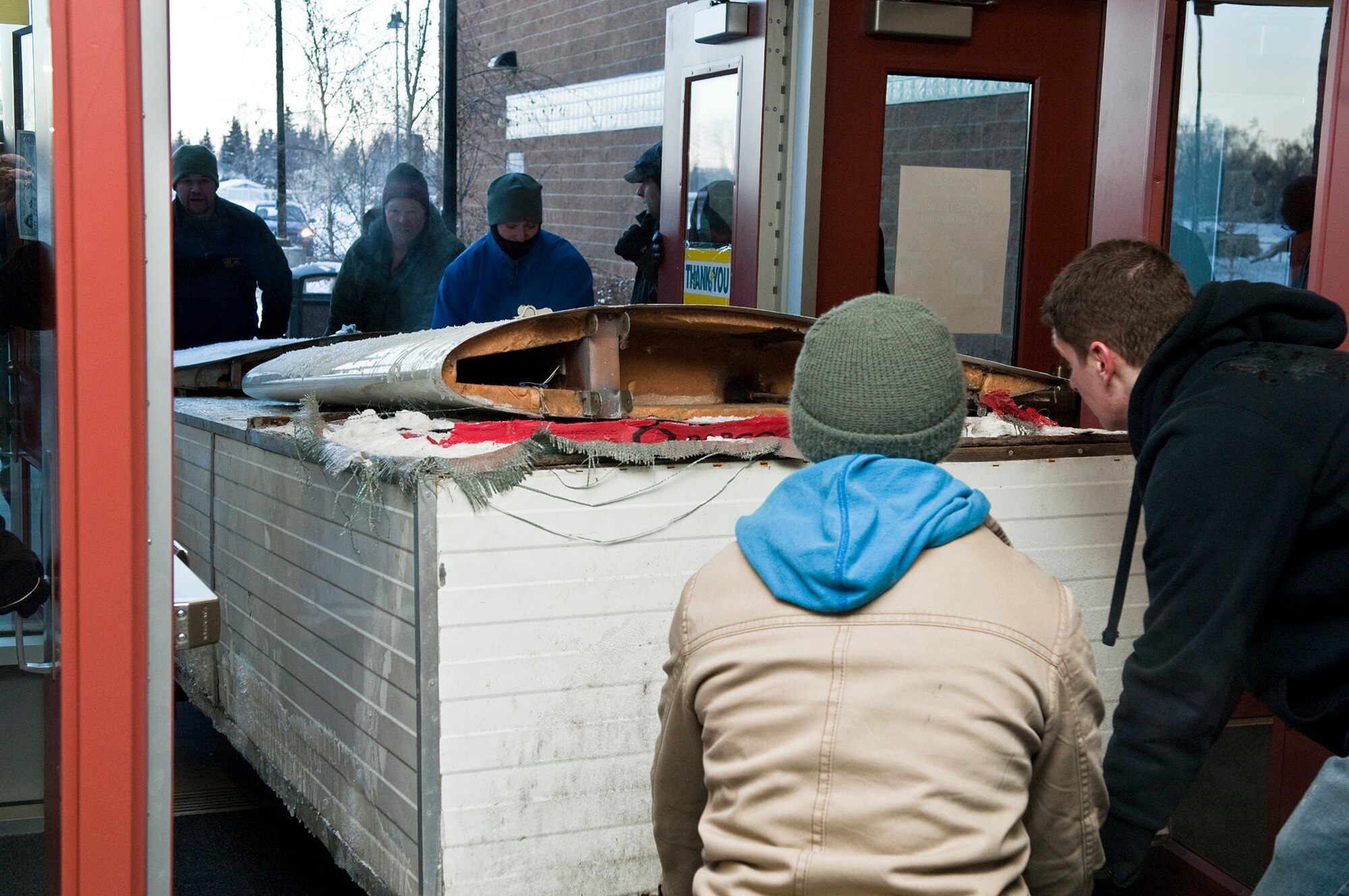 ANCHORAGE, Alaska -- Volunters from Joint Base Elmendorf-Richardson move an ultra-light model plane to Begich Middle School for the Build-a-Plane program. The Build-a-Plane program is designed to inspire children to become involved in aviation. (U.S. photo/Airman 1st Class Jack Sanders)