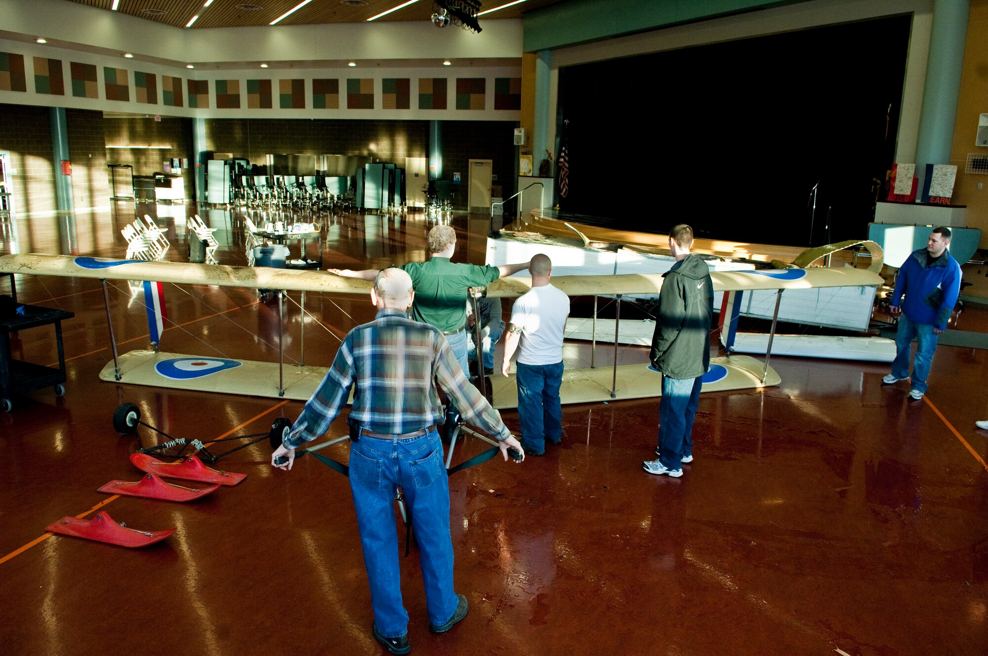 ANCHORAGE, Alaska -- Volunters from Joint Base Elmendorf-Richardson move an ultra-light model plane to Begich Middle School for the Build-a-Plane program. The Build-a-Plane program is designed to inspire children to become involved in aviation. (U.S. photo/Airman 1st Class Jack Sanders)