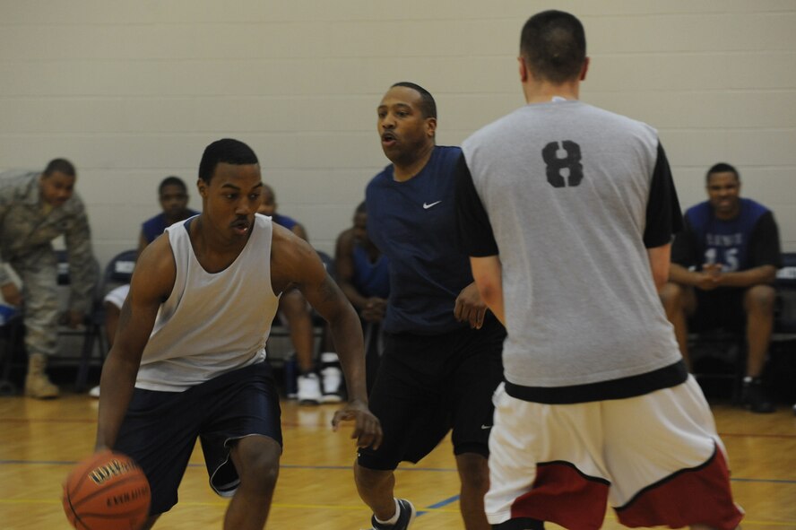 MINOT AIR FORCE BASE, N.D. -- The McAdoo fitness center held its first ever Old School (over 30) vs New School (intramurals) basketball event here Feb. 22. With six seconds left in overtime, New School was victorious after stealing and dunking the game ball. The final score was 74-71. (U.S. Air Force photo/Airman 1st Class Aaron-Forrest Wainwright)


