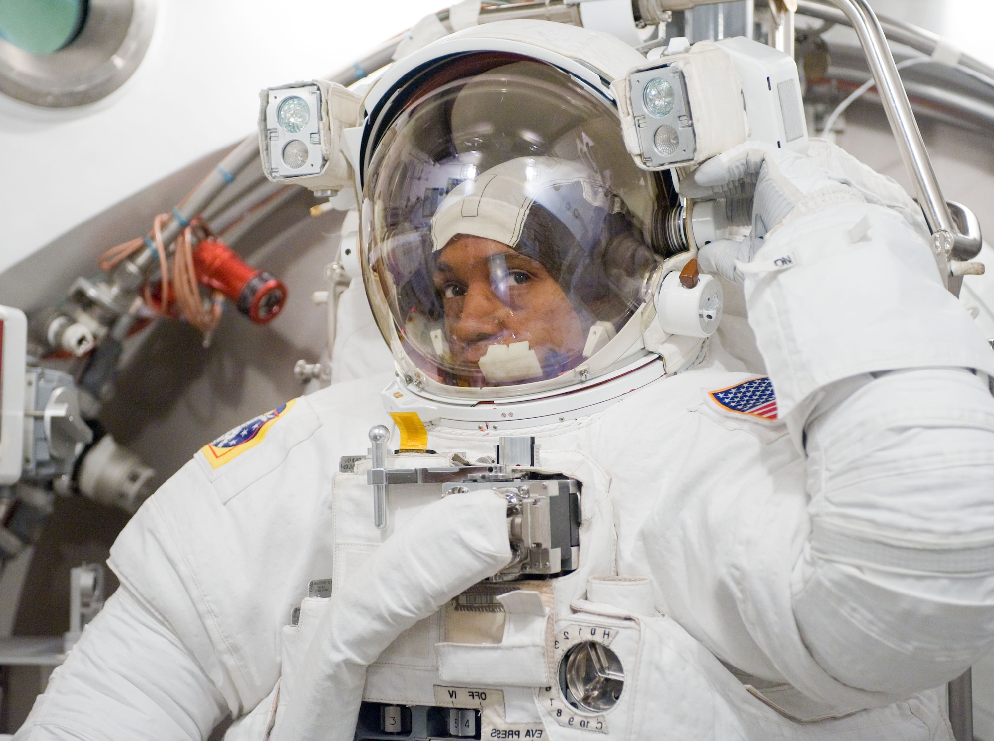 STS-133 mission specialist B. Alvin Drew undergoes an Extravehicular Mobility Unit spacesuit fit check in the Space Station Airlock Test Article at NASA's Johnson Space Center June 24, 2010. Mr. Drew is one of three Air Force Academy graduates for the mission aboard Space Shuttle Discovery, scheduled for liftoff Feb. 24, 2011. (NASA Photo/Mark Sowa)