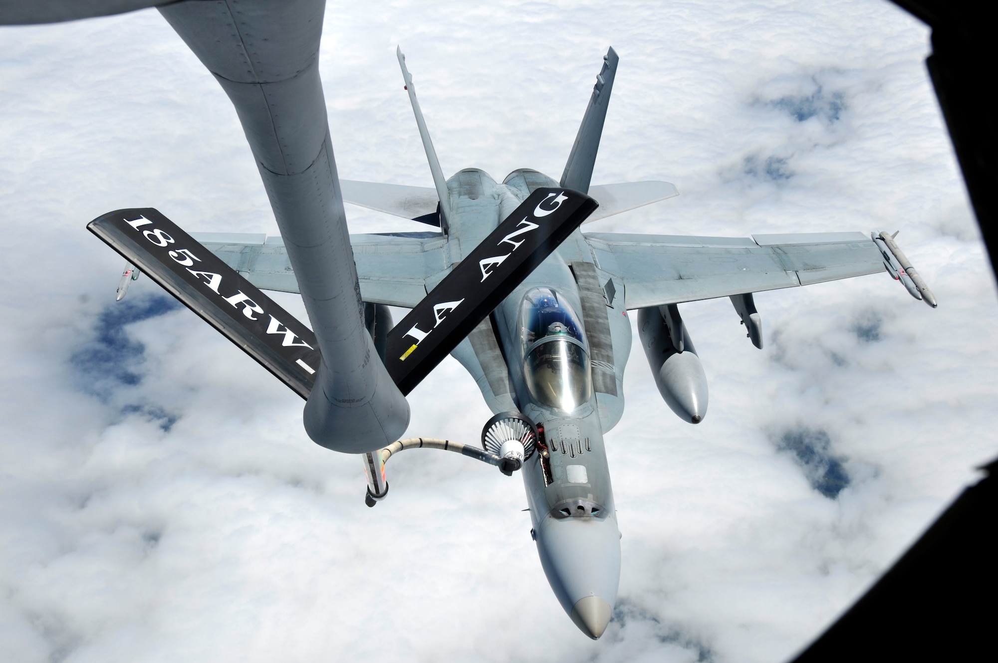 An F-18 Fighter Jet from the Royal Australian Air Force receives fuel from a KC-135 Tanker, from the 185th Air Refueling Wing (ARW) Sioux City, Iowa, Iowa Air National Guard, over the coast of Eastern Australia, in Williamtown, New South Wales, on February 23, 2011. The 185th ARW is participating in a joint flight exercise, "Sentry Down Under", refueling F-16C and F-18 Fighter Jets in Australia.
(USAF Photo/ Tech. Sgt. Oscar M. Sanchez-Alvarez)


