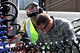 Tech. Sgt. Bryon Adams(right) from the 185th Air Refueling Wing (ARW) Sioux City, Iowa, Iowa Air National Guard, and  Leading Aircrafts Men (LAC) Greg McMahon, from the Royal Australian Air Force (RAAF) Base, Williamtown, New South Wales, Australia, sign forms after refueling a KC-135 Tanker, on February 23, 2011. The 185th ARW is participating in a joint flight exercise, 
