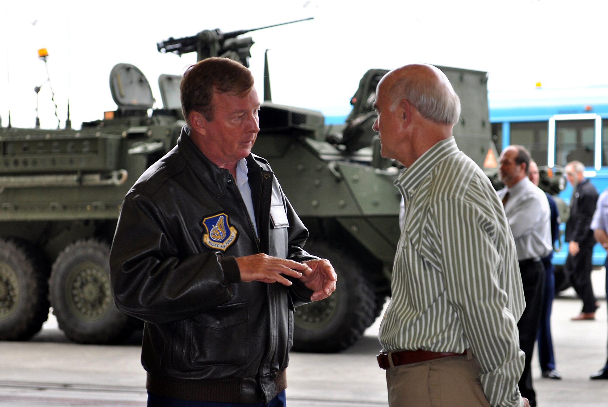 JOINT BASE ELMENDORF-RICHARDSON, Alaska -- Lt. Gen. Dana T. Atkins, Alaskan Command Commander, talks with Mr. Rich Hadley during an Air Force Chief of Staff Civic Leader visit to Alaska Command Aug. 9. The tour was to provide civic leaders an opportunity to experience firsthand the Alaska mission across the Joint Operating Area and provide an opportunity for interaction and networking among joint service members and civic leaders.  (Air Force photo by Senior Airman Cynthia Spalding) 
