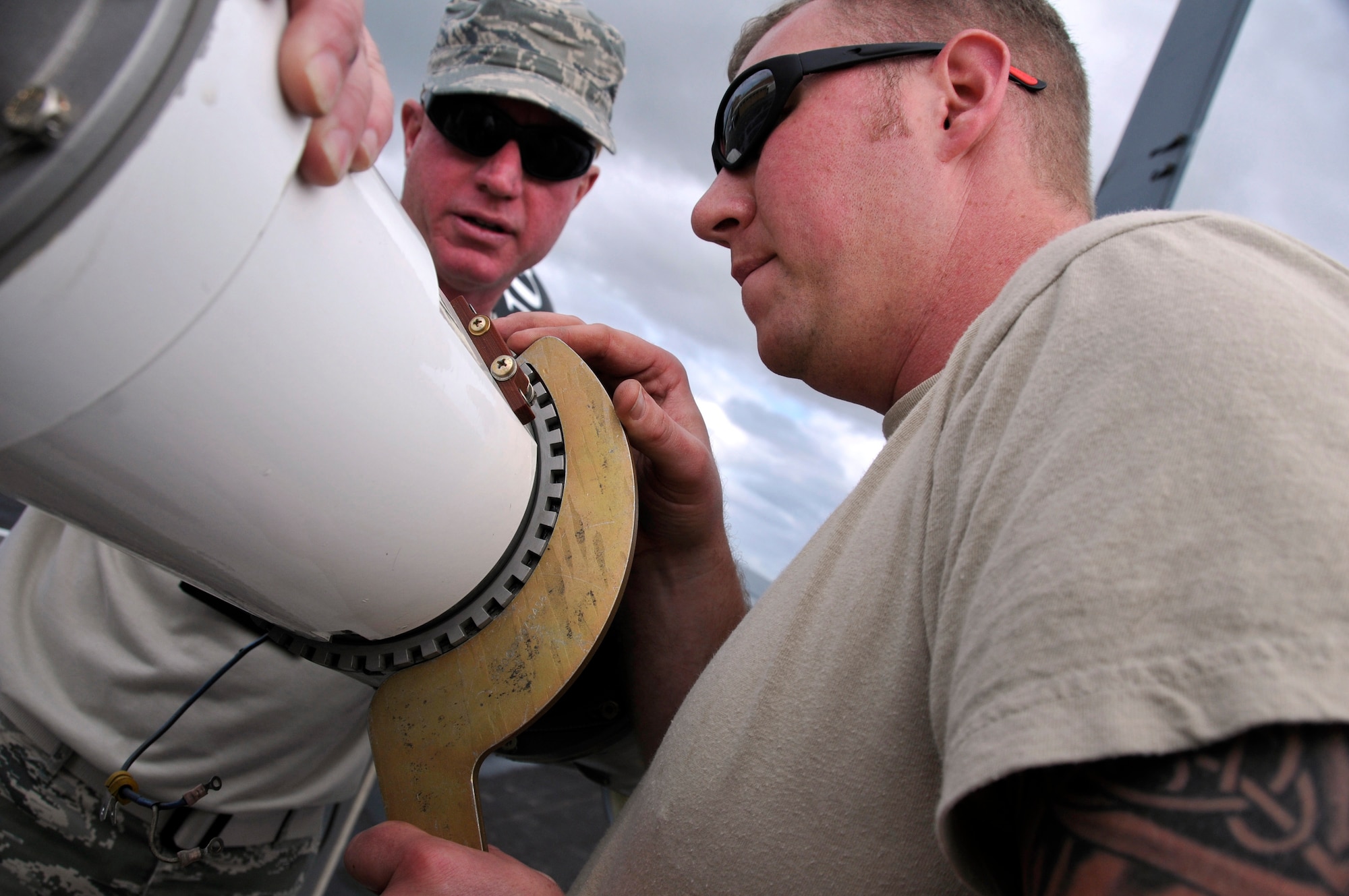 Tech. Sgt. Byron Adams(right) and Chief Master Sgt. Mark Wankum, with the 185th Air Refueling Wing (ARW), Sioux City, Iowa, Iowa Air National Guard, install a drogue on a KC-135 Tanker , which will refuel an Australian F-18 Fighter Jet, at the Royal Australian Air Force (RAFF) Base, Williamtown, New South Wales, Australia, on February 22, 2011. The 185th ARW is participating in a joint flight exercise, "Sentry Down Under", refueling F-16C and F-18 Fighter Jets in Australia.
(USAF Photo/ Tech. Sgt. Oscar M. Sanchez-Alvarez)
 
