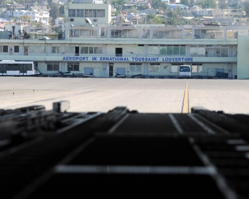 JOINT BASE CHARLESTON, S.C. -- The airport sign at Port-au-Prince, Haiti, can be seen from the back of a C-17 Globemaster III hailing from Altus AFB. A crew from the 58th Airlift Squadron delivered building materials and food in support of relief operations in Haiti, Feb.19. The delivery was possible because of the Denton Program, which allows donors to use space available on U.S. military cargo aircraft to transport humanitarian goods and equipment to countries in need. (U.S. Air Force photo by Airman 1st Class Kenneth W. Norman)