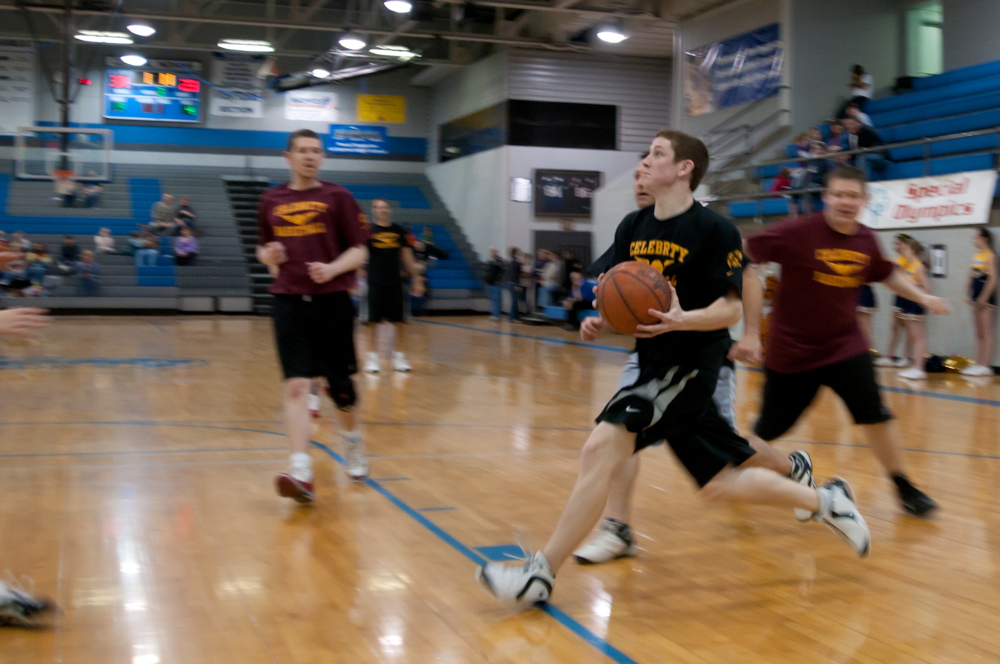 A member of the 139th Airlift Wing, Missouri Air National Guard, goes for a lay up during the 1st Annual Celebrity Basketball Game, hosted by the Special Olympics division in St. Joseph, Mo., Feb. 19, at Central High School. (U.S. Air Force photo by Staff Sgt. Michael Crane)