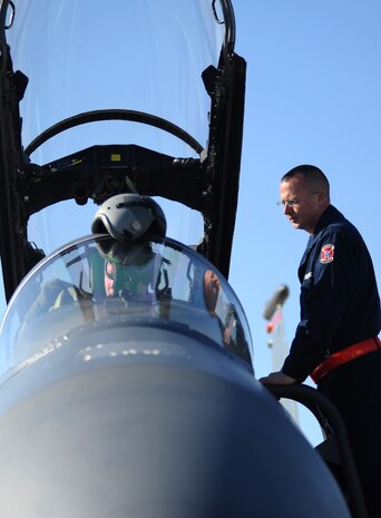 Senior Airman Matthew Sims awaits the O.K. from the pilot before removing the cockpit support on the flight line Feb. 23 on Joint Base Charleston - Air Base, S.C. The F-15E Strike Eagle can reach speeds up to 1,875 miles per hour for more than 2,000 miles. Airman Sims is a crew chief with the 333rd Aircraft Maintenance Squadron from Seymour Johnson Air Force Base. (U.S. Air Force photo/Senior Airman Timothy Taylor)