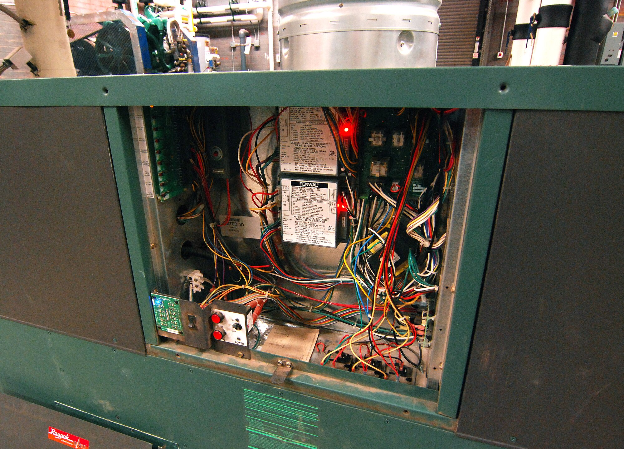 This is the electronic control circuitry on a boiler located in the plant room for building 838.  It is one of the many end-points in the Energy Management Control System that allows CE personnel to remotely monitor and control environmental systems around the base to ensure a more efficient use of energy.   (U.S. Air Force photo/ Brad Fallin)