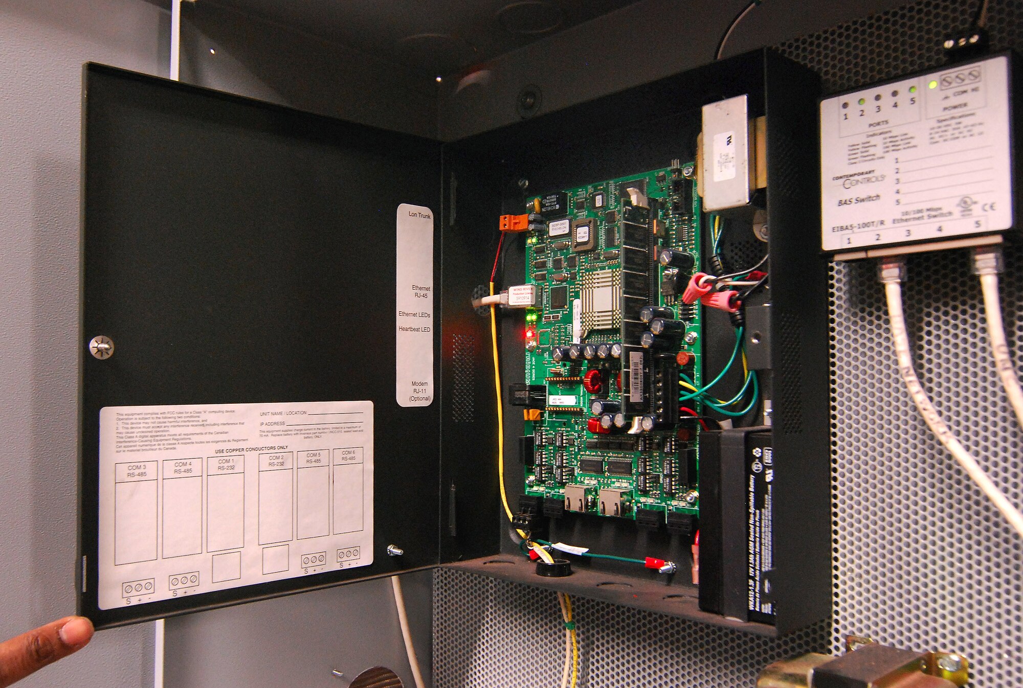 This panel in building 838's plant room is where sensors and controls throughout the building are integrated into the Energy Management Control System, allowing CE personnel to remotely monitor and control the building's environmental systems to ensure the most efficient use of energy.   (U.S. Air Force photo/ Brad Fallin)