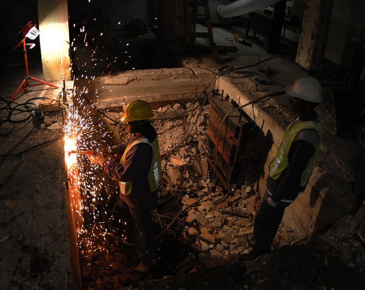 Michael Burton, construction worker, welds pipes on an old service elevator during the construction of the new command post at Barksdale Air Force Base, La., Feb. 23. The 2nd Bomb Wing Command Post, currently operating from Air Force Global Strike Command Headquarters, will soon transfer to Bldg. 3433. (U.S. Air Force photo/ Senior Airman Alexandra M. Boutte) (RELEASED)