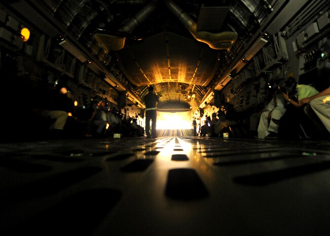 The lights go dark for honorary commanders during night vision goggle training onboard a C-17 Globemaster III Feb. 22, 2011 on Joint Base Charleston, S.C. Honorary commanders were given the opportunity to dine in on the C-17 and ask the crew questions about the aircraft and their missions. (U.S. Air Force photo/Senior Airman Timothy Taylor)
