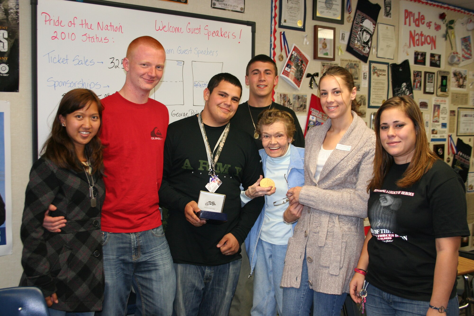 Marguerite "Ty" Killen is shown during her last visit to Mrs. Jamie Goodreau's history class at Lancaster High School. Surrounded by the history class students, Ms. Killen proudly holds the Congressional Gold Medal she received March 10, 2010. (Photo courtesy of Jamie Goodreau)