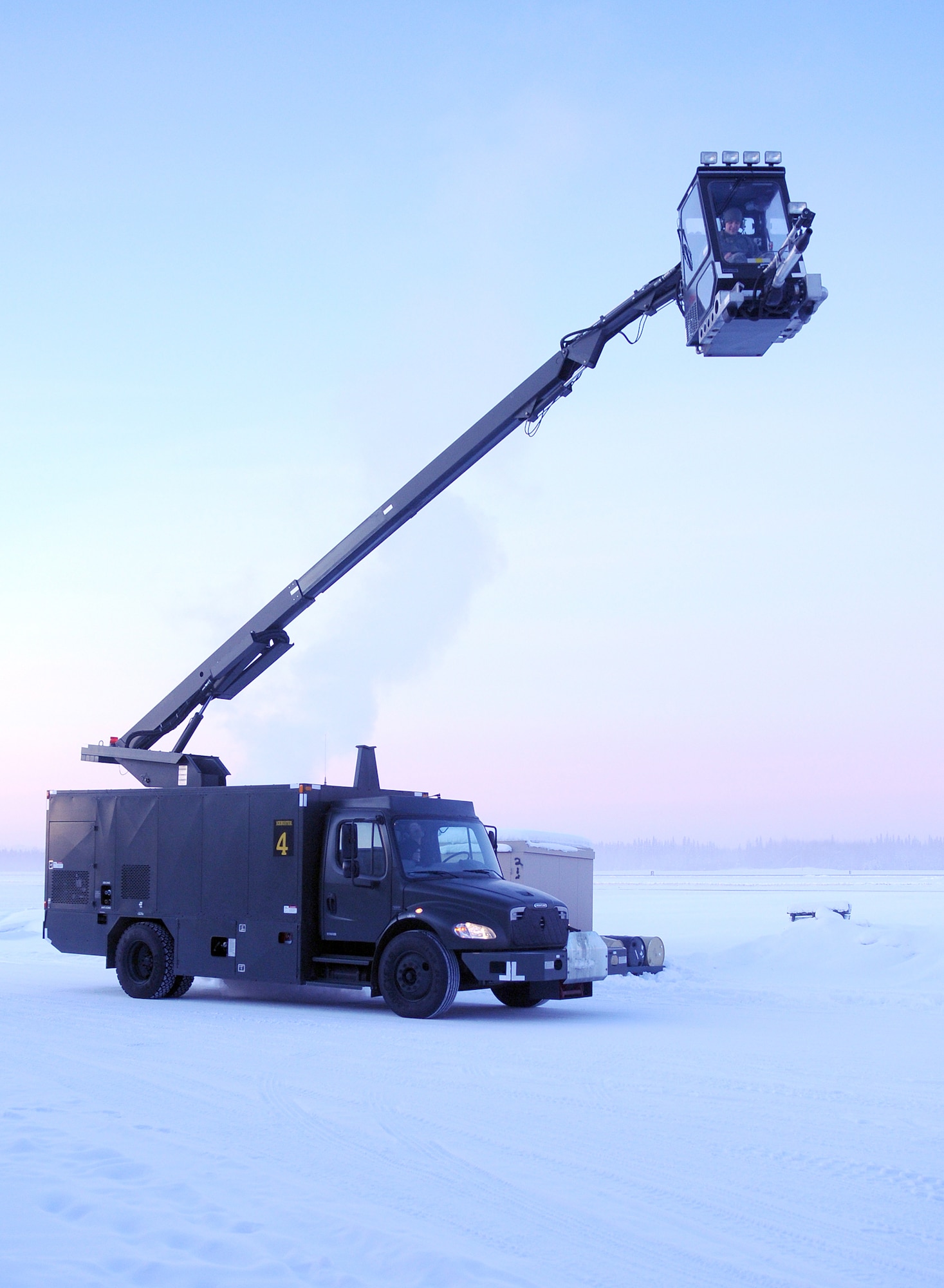 A de-icer operator checks lift controls Feb. 16, 2011, at Eielson Air Force Base, Alaska. The operators are assigned to the 354th Maintenance Squadron aerospace ground equipment flight. (U.S. Air Force photo/Airman 1st Class Janine Thibault)
