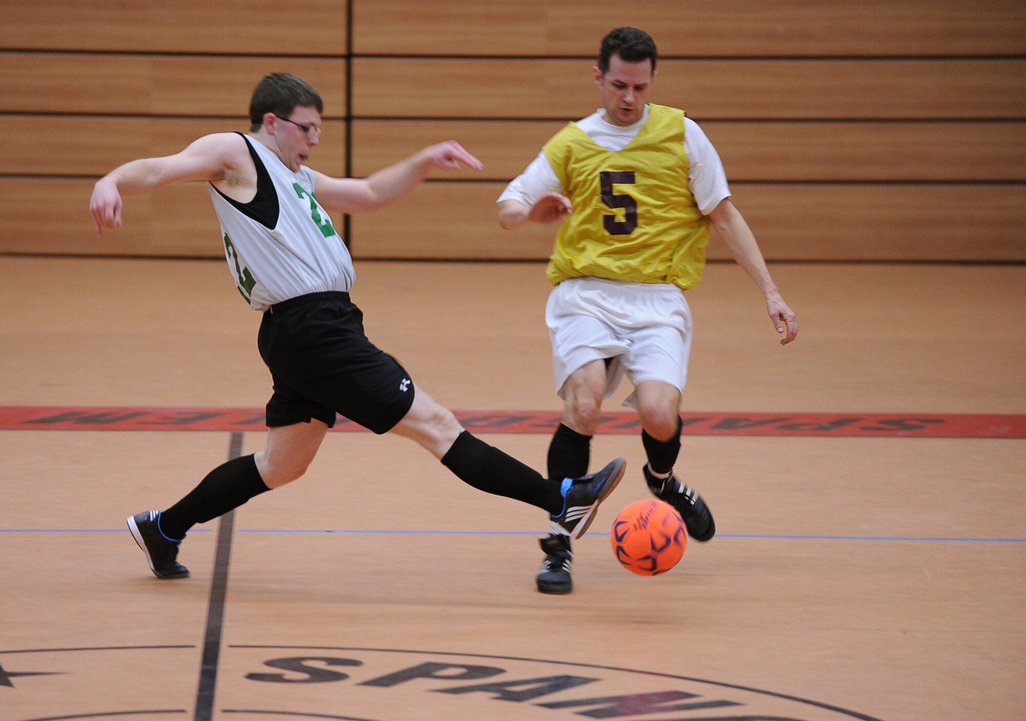 SPANGDAHLEM AIR BASE, Germany – Gregory Parks, left, 606th Air Control Squadron team coach, tries to steal the ball from Benjamin Carpenter, 81st Fighter Squadron, during the first game of the indoor soccer season Feb. 22 at the Skelton Memorial Fitness Center. The 81st FS team crushed the 606th ACS 13-1. (U.S. Air Force photo/Staff Sgt. Benjamin Wilson)