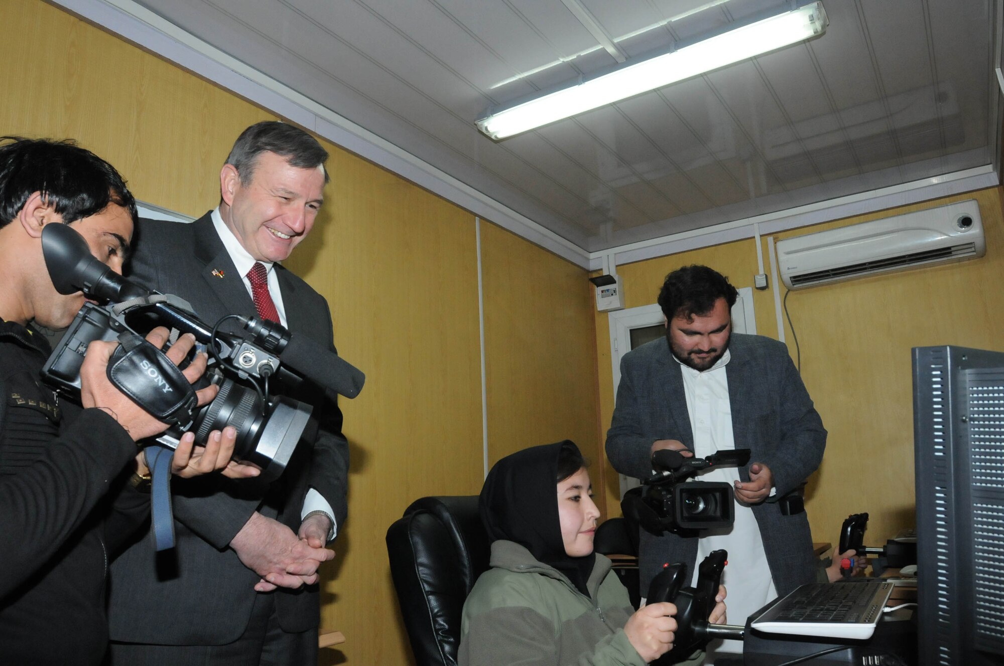 KABUL, Afghanistan - U.S. ambassador to Afghanistan Karl Eikenberry toured the Afghan Air Force English immersion lab known as the “Thunder Lab” at Kabul, Afghanistan Feb. 23.  (U.S. Navy Photo by Mass Communications Specialist 3rd Class Jared E. Walker)