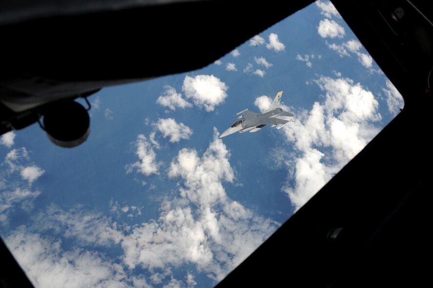 After being refueled by a KC-135 fuel tanker from the 185th Aerial Refueling Wing (185ARW), Sioux City, Iowa, an F-16 C+ aircraft from the 132nd Fighter Wing (132FW), Des Moines, Iowa is seen breaking away through the boom window of the KC-135 to continue its flying mission for Dissimilar Air Combat Training (DACT) in the skies over Australia on February 22, 2011.  The 185ARW and 132FW are engaged in "Sentry Down Under" with the Royal Australian Air Force, Williamtown F-18 aircraft.  (US Air Force photo/Staff Sgt. Linda E. Kephart)(Released)  