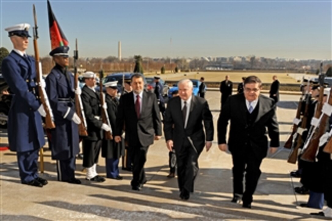 Secretary of Defense Robert M. Gates (2nd from right) escorts Afghan Minister of the Interior Bismullah Mohammadi (3rd from right) and Defense Minister Abdul Rahim Wardak (right) through an honor cordon and into the Pentagon on Feb. 23, 2011.  