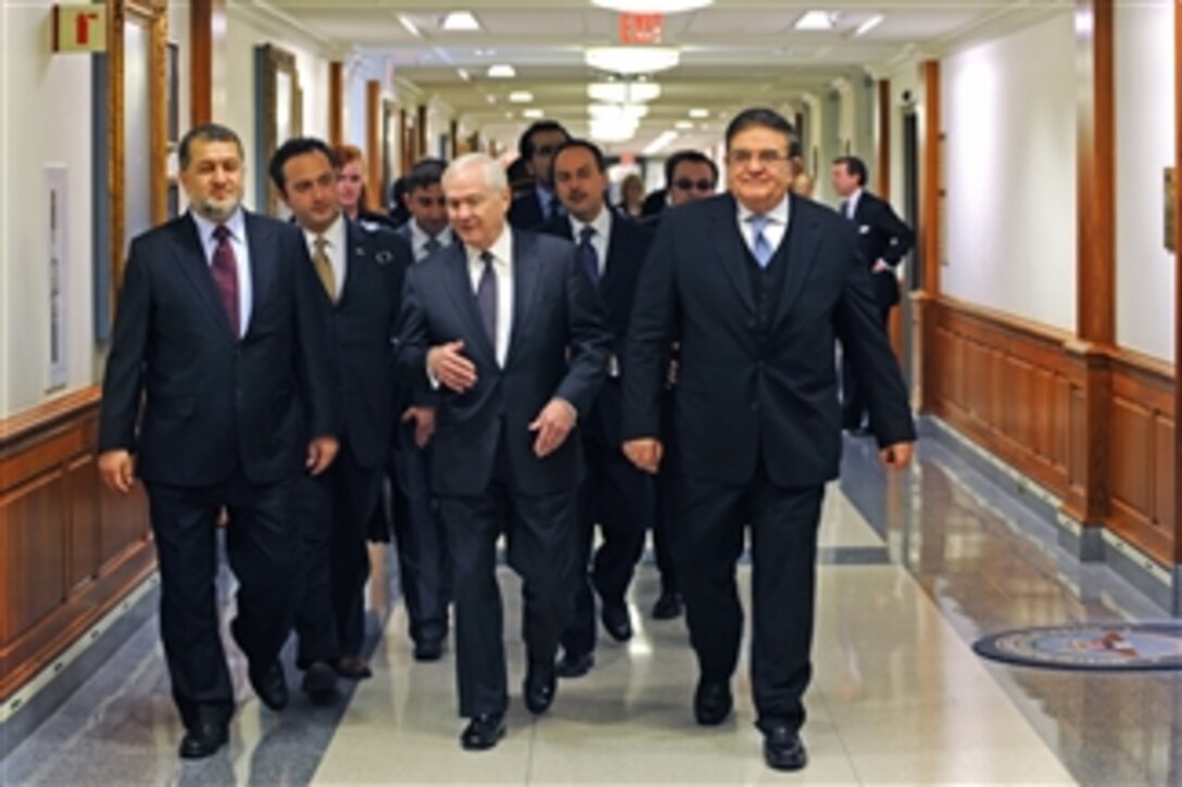 Secretary of Defense Robert M. Gates (3rd from left) escorts Afghan Minister of the Interior Bismullah Mohammadi (left) and Defense Minister Abdul Rahim Wardak (right) to a Pentagon conference room where they will participate in the first of what are hoped to become twice-yearly U.S.-Afghan security consultation forums on Feb. 23, 2011.  