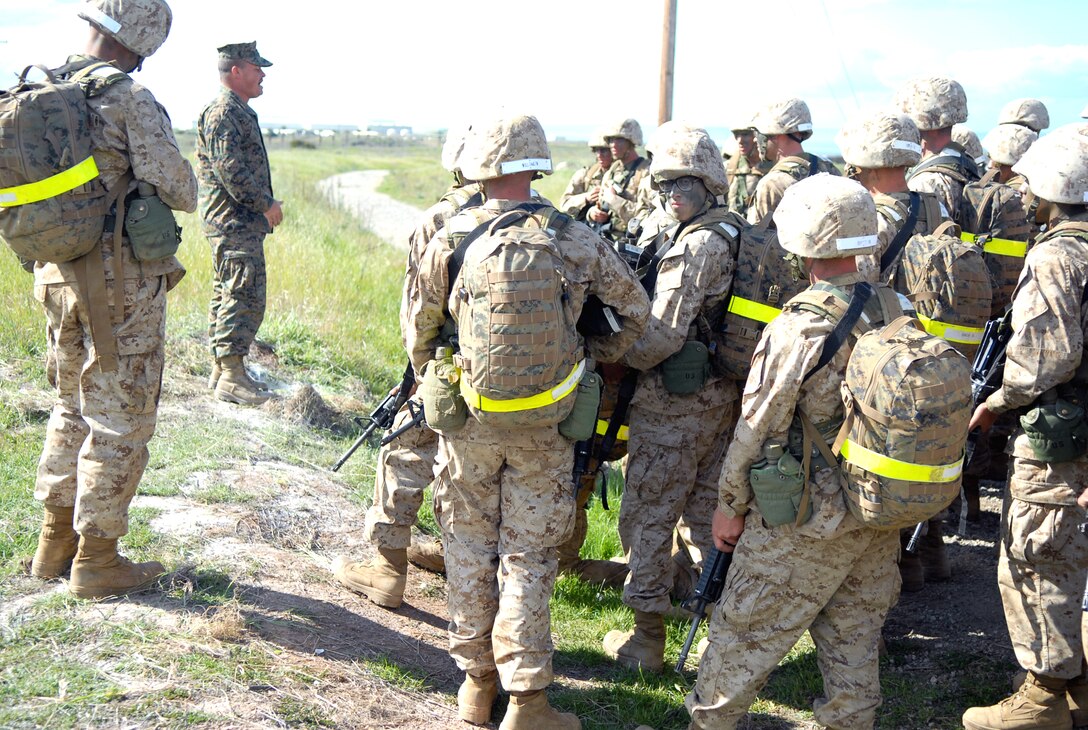 Sgt. George O’Donnell, field instructor with Field Training Platoon, Field Company, Weapons and Field Training Battalion, Camp Pendleton, Calif., tells Co. D recruits how to recognize improvised explosive devices during the Crucible.