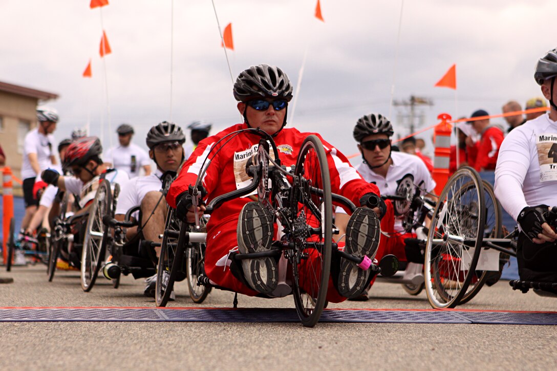 Nathan Peck, a cyclist, shot-put and discus thrower for the Battalion West Team, awaits the command with other participants at the start line of the 2011 Marine Corps Trials 10 kilometer hand-cycling portion of the race at Camp Pendleton, Feb. 23. Peck, a native of Salmon, Idaho, suffered lower back injuries and Post Traumatic Stress Disorder after a 2009 tour of duty in Iraq.