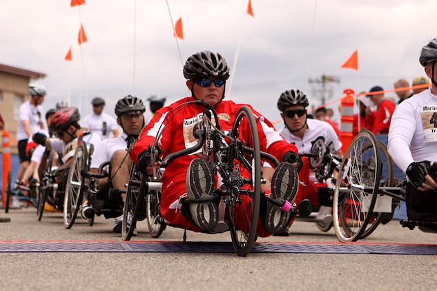 Nathan Peck, a cyclist, shot-put and discus thrower for the Battalion West Team, awaits the command with other participants at the start line of the 2011 Marine Corps Trials 10 kilometer hand-cycling portion of the race at Camp Pendleton, Feb. 23. Peck, a native of Salmon, Idaho, suffered lower back injuries and Post Traumatic Stress Disorder after a 2009 tour of duty in Iraq.
