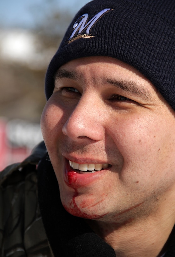 Staff Sgt. Jesse Olin, Recruiting Substation Bloomington, remains in high spirits even after one of his fellow Marines fell on his head, busting his lip at the Recruiting Station Twin Cities Broomball Tournament Feb. 25. For more photos of the event, visit the RS Twin Cities fan page at www.facebook.com/rstwincities.