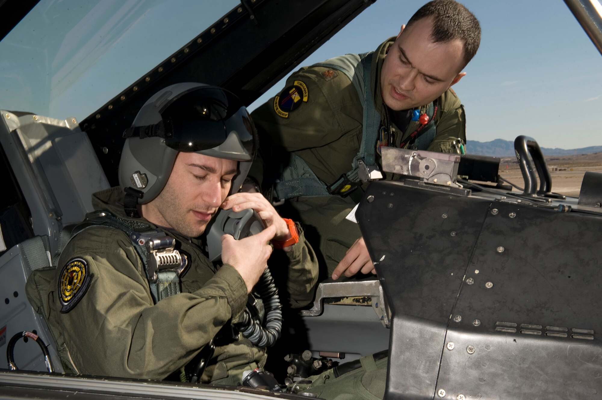 Simon Sinek goes through preflight procedures with Maj. Lawrence Sullivan prior to an F-16 Fighting Falcon orientation flight Feb. 23, 2011, at Nellis Air Force Base, Nev. Mr. Sinek helped U.S. Air Force Weapons School officials develop a new curriculum focused on creating the next generation of Air Force leaders, and spoke during the inaugural class Feb. 22, 2011. Mr. Sinek is an internationally renowned speaker and author. Major Sullivan is a USAFWS instructor assigned to the 16th Weapons Squadron. (U.S. Air Force photo/Senior Airman Brett Clashman)