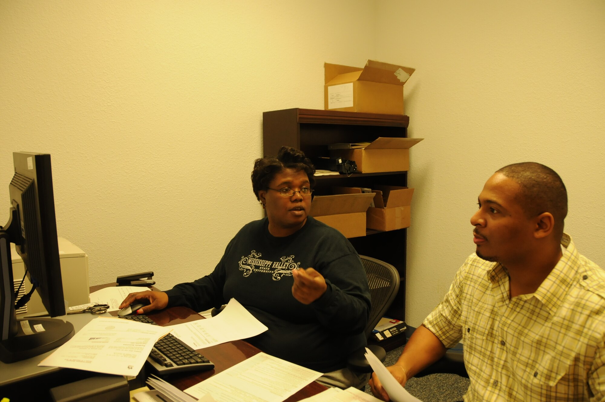Parlee Barrow, left, 81st Comptroller Squadron, assists Tech. Sgt. Donelle Clark, 81st Surgical Operations Squadron, in filing his taxes Feb. 17 at the tax office in Room 229, Sablich Center. The office is open 8 a.m. to 3 p.m.Monday through Thursday and 8 a.m. to 2 p.m. on training Fridays. For more information and appointments, call 376-8141.  (U.S. Air Force photo by Airman 1st Class Heather Heiney)