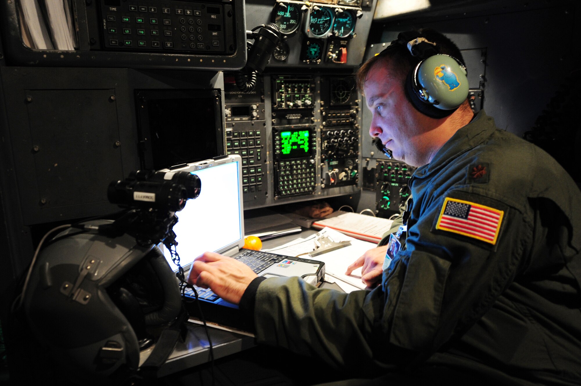 Maj. Matthew Campbell, a 50th Airlift Squadron navigator, monitors the flight path of a C-130H during a Joint Operational Access Exercise Feb. 14, 2011 at Pope Air Force Base, N.C. Major Campbell navigated the aircraft to a destination seen only through a night observation device. (Photo by U.S. Air Force Senior Airman Jim Araos)