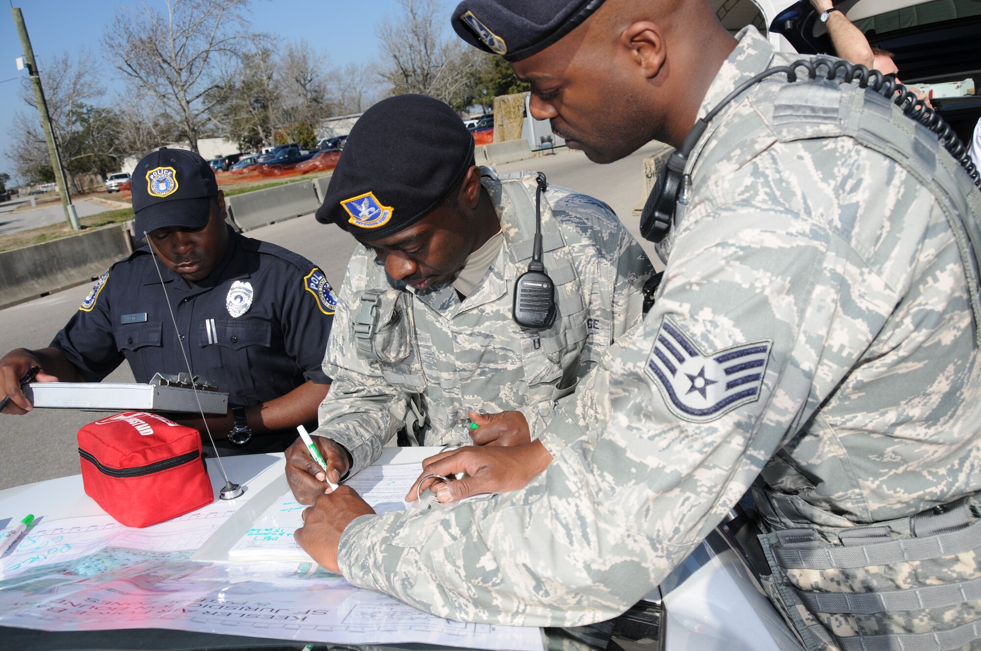 Frank Lewis, Tech. Sgt. Phillip Belle and Staff Sgt. Teddy Poole, 81st Security Forces
Squadron, log wreckage personnel accountability.  (U.S. Air Force photo by Kemberly Groue)