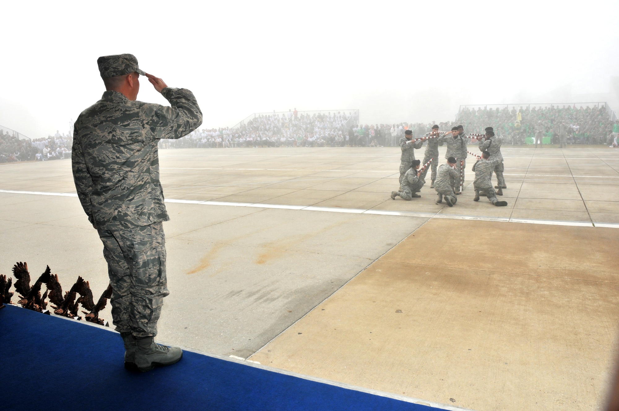 Friday’s heavy fog nearly obscured the Red Wolves’ freestyle team on the drill pad as they were observed By Col. Glen Downing, 81st Training Wing vice commander. Colonel Downing served as the reviewing officer for the first drill competition of the year.   (U.S. Air Force photo by Adam Bond)