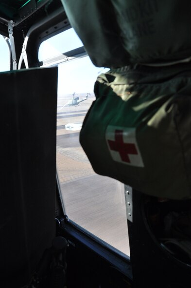 A Bell UH-1N Huey helicopter, operated by Capt. Matt Konowiez, Lt. Jon Gentri and Staff Sgt. Rich Bartlett, all from the 37th Helicopter Squadron, carries its crew and passengers over Nebraska fields and back to F. E. Warren AFB after Vice Admiral Cecil Haney, USSTRATCOM deputy commander's visit to the missile alert facility Juliet-01 Feb. 22. (U.S. Air Force photo by Airman 1st Class Dan Gage)