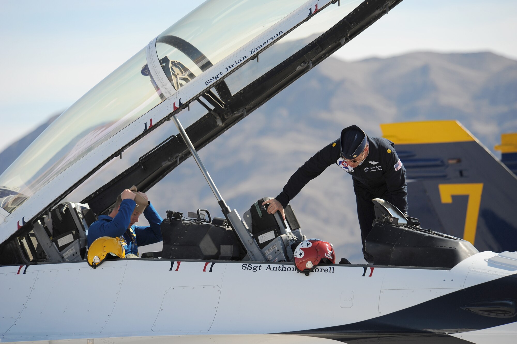 Maj. Aaron Jelinek (right) and Lt. Ben Walborn return from a training mission Feb. 23, 2011, at Nellis Air Force Base, Nev. Major Jelinek is the Thunderbirds lead solo. Lieutenant Walborn is the Navy Blue Angels lead solo. (U.S. Air Force photo/Staff Sgt. Larry E. Reid Jr.) 