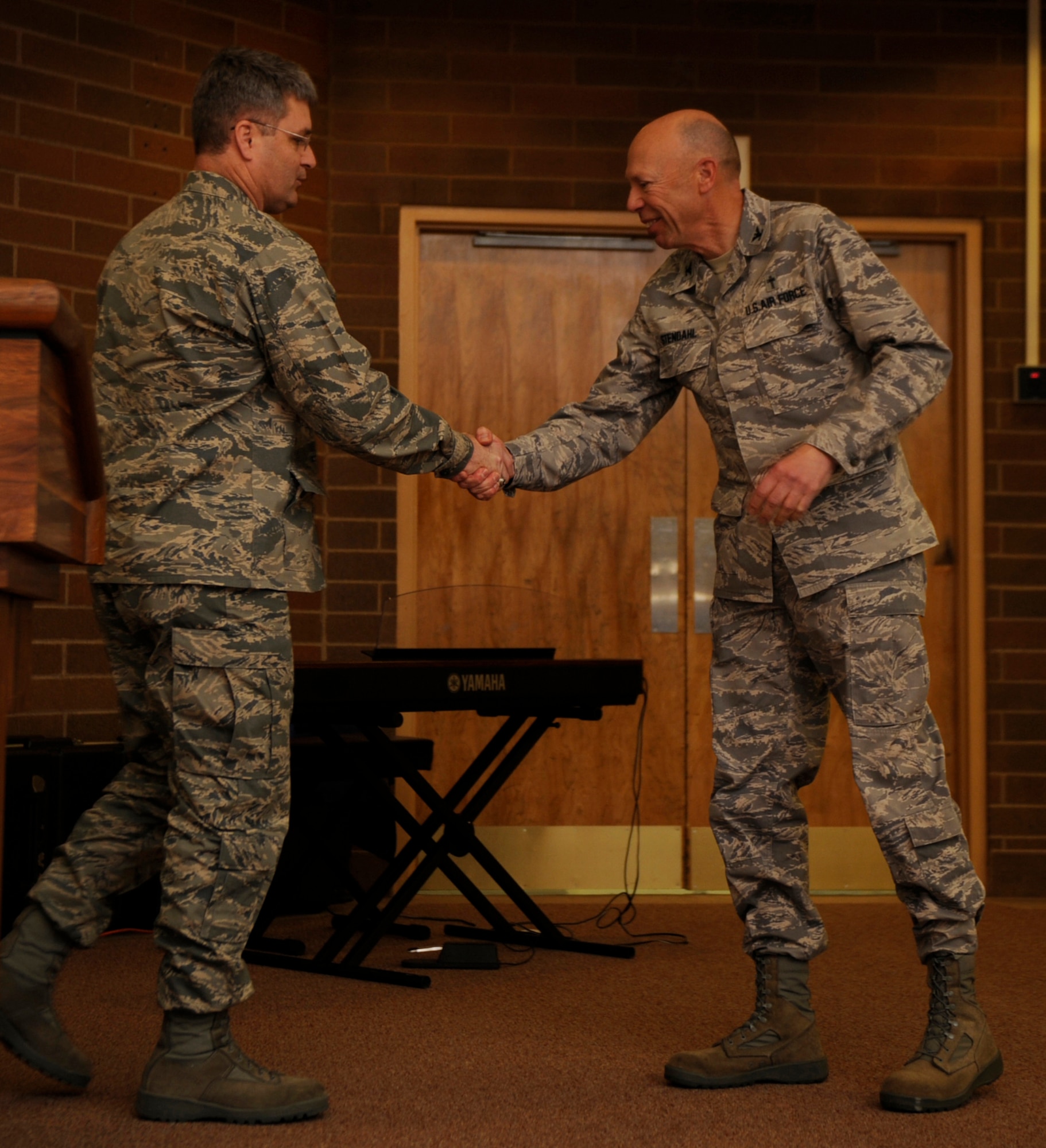 MOUNTAIN HOME AIR FORCE BASE, Idaho -- Col. Ron Buckley, 366th Fighter Wing commander, thanks Chaplain (Col.) Howard Stendahl, Air Combat Command chaplain, for being the guest speaker during the National Prayer Luncheon Feb. 22 at the Gunfighter Club. Chaplain Stendahl is responsible for the ACC chaplain corps programs and providing Airmen and their families with spiritual care and opportunities for the free exercise of religion. (U.S. Air Force photo by Airman 1st Class Renishia Richardson)