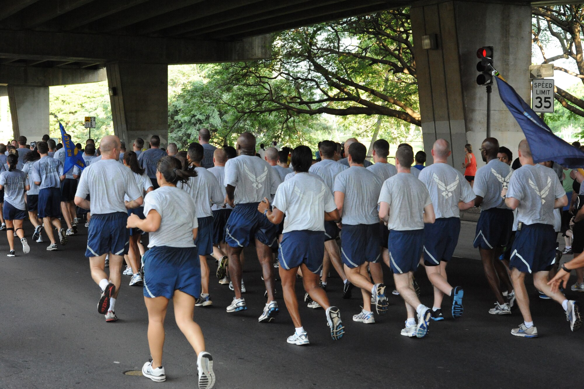 Approximately 25 members of the 15th Wing at Joint Base Pearl Harbor Hickam, Hawaii participate in the Great Aloha Run Feb. 21. The run, which started at Aloha Tower in Honolulu and ended at Aloha Stadium, stretched more than eight miles. (U.S. Air Force photo by Staff Sgt. Nathan Allen) 