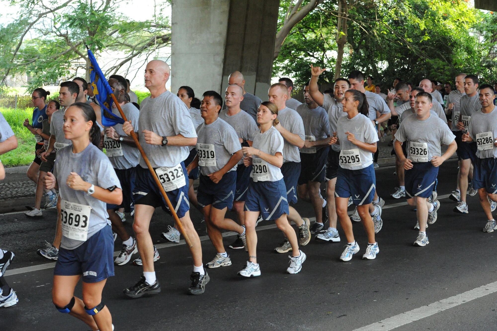 Approximately 25 members of the 15th Wing at Joint Base Pearl Harbor Hickam, Hawaii participate in the Great Aloha Run Feb. 21. The run, which started at Aloha Tower in Honolulu and ended at Aloha Stadium, stretched more than eight miles. (U.S. Air Force photo by Staff Sgt. Nathan Allen) 