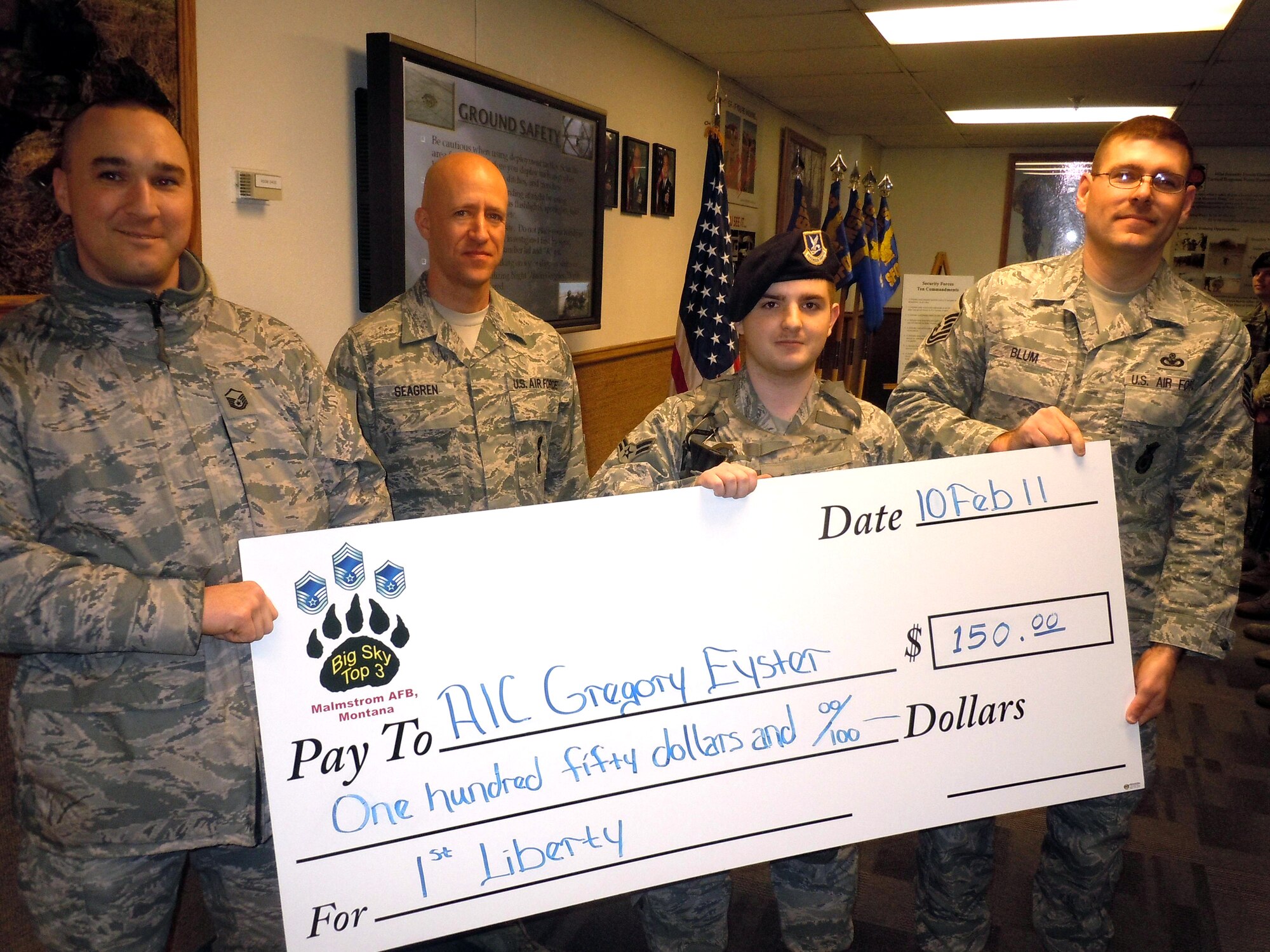 Top 3 Council members from left to right, Master Sgts. Christopher Smith, Frank Seagren and Anthony Blum, also presented a check to Airman 1st Class Gregory Eyster. Each quarter, the council selects one NCO and one Airman to receive the educational stipen based on an essay submission. (U.S. Air Force Courtesy Photo)