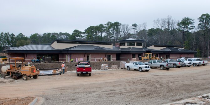 MOODY AIR FORCE BASE, Ga. -- Contractors work at the new Child Development Center construction site Feb. 24. The new CDC, which is scheduled to be completed this summer, will be Leadership in Energy and Environmental Design-certified at the silver level. LEED is a consensus-based standard to support and certify successful green building designs, constructions and operations. It verifies that a building is environmentally responsible and is a healthy place to live and work. (U.S. Air Force photo/Staff Sgt. Jamal D. Sutter)(RELEASED)